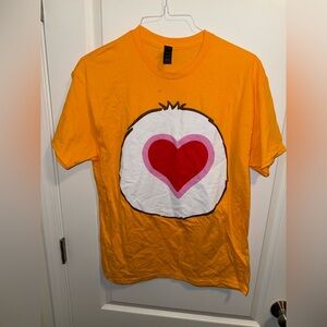 Care Bears Men’s Tenderheart Bear Belly Badge Graphic Print SS Costume Tee